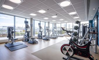 a well - equipped gym with a variety of exercise equipment , including treadmills , stationary bikes , and weight machines at Hampton by Hilton Stockton on Tees