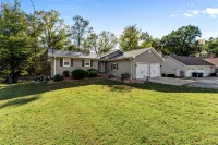 3 bedroom/2 full bath lakefront home with gentle slope to private covered dock