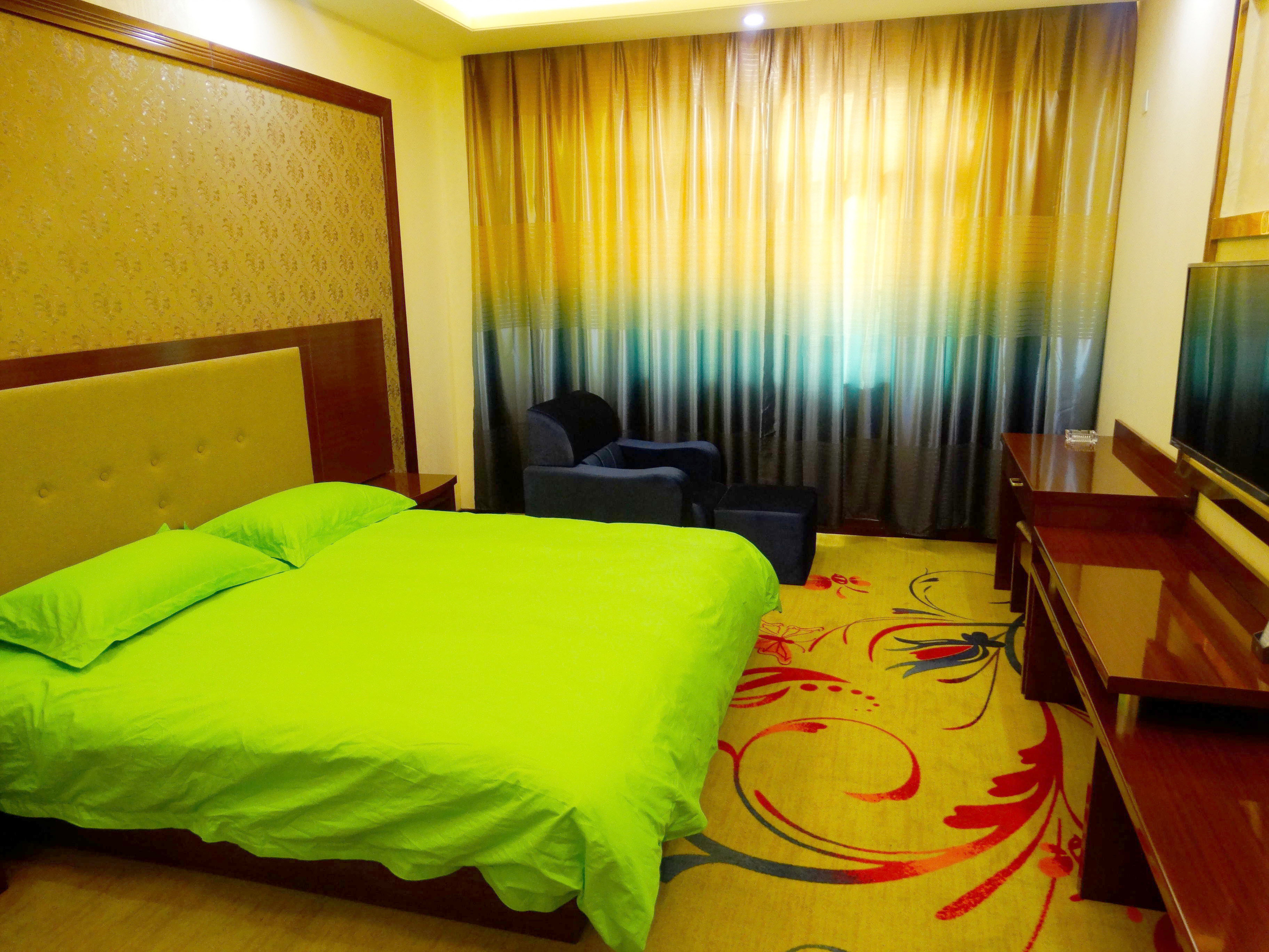 Mulei Sunshine Flower Garden HotelKing-size bed room
