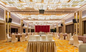 a large , elegant banquet hall with multiple dining tables and chairs arranged for a formal event at Lakeside Hotel