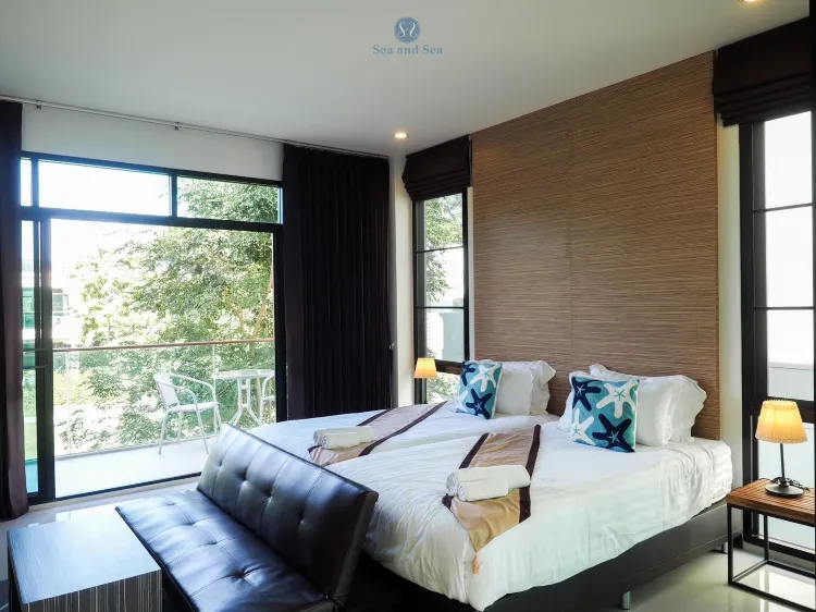 ห้องพักพร้อมระเบียงและวิวสวน(เตียงใหญ่)