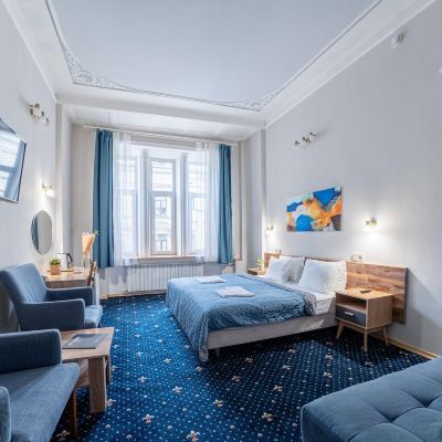 The Room Is An Improved Standard with A Sofa Alexander Hotel Promo Code