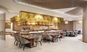 a modern restaurant with wooden tables , chairs , and a large gold bar , creating an elegant atmosphere at Sheraton Can Tho