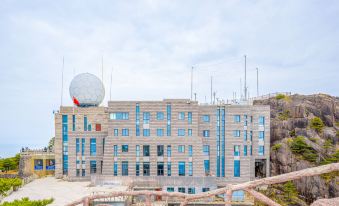 "A large building with a view of the outside and the words ""I love you"" displayed in front" at Guangmingding Hotel