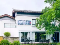 Songfengju Courtyard Hotel (Xingyi Wanfenglin Airport & High-speed Railway Station Branch)