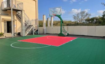 The hotel offers a basketball court with an outdoor play area and surrounding basket netting at Ramada Encore by Wyndham Shanghai Pudong Airport