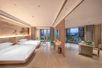 Menghai Boting Hotel (Xishuangbanna Menghai Mengbala International Resort Rainforest Avenue Branch)