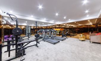 The gym provides a well-lit and spacious area for personal use at Yizhi Hotel