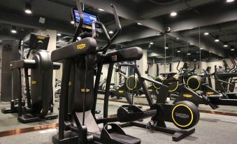 a well - equipped gym with various exercise equipment , such as treadmills , ellipticals , and stationary bikes at Dorsett Wanchai