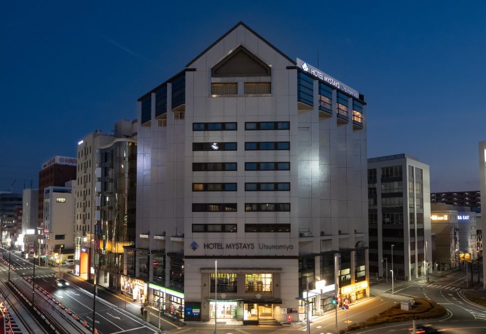 "a large white building with a pointed top and the name "" lotte company "" on it" at HOTEL MYSTAYS Utsunomiya