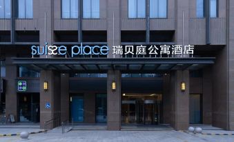"the exterior of a hotel with a sign that reads "" au 's w place "" above the entrance" at Suisse Apartment Hotel Suzhou Jinji Lake Expo Center