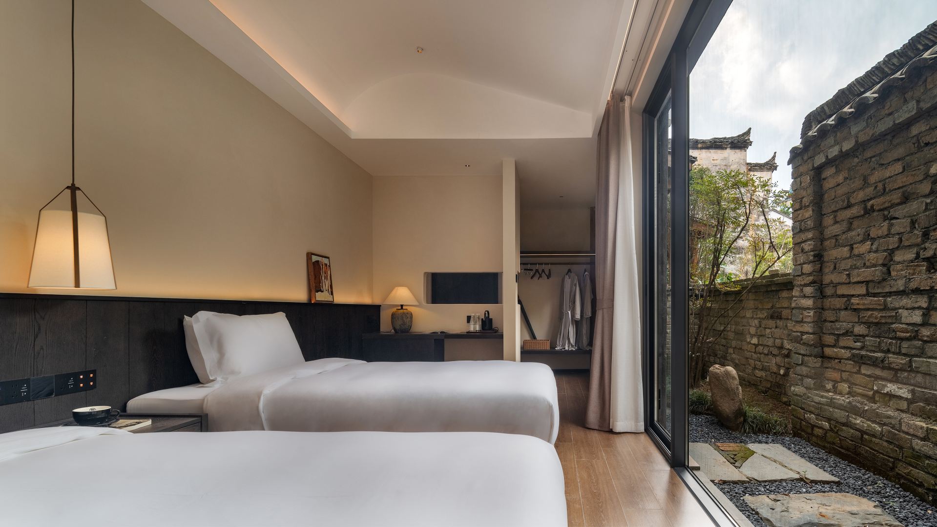 Elegant Courtyard View Twin Beds Room