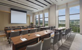 The new boardroom offers a spacious setting with tables and chairs for meetings or other gatherings at Hyatt Place Hangzhou International Airport