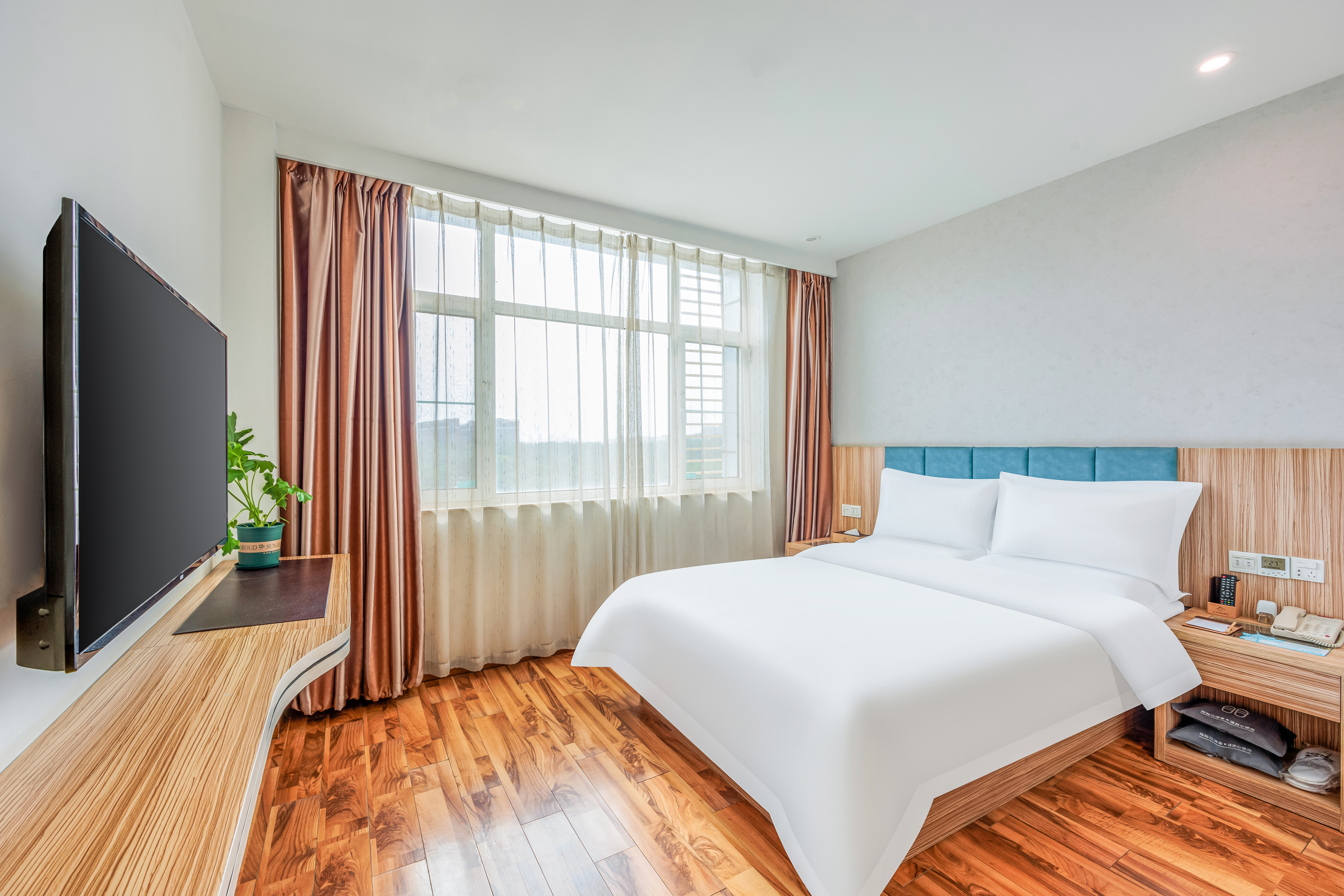 商务阳光大床房（独立空调+席梦思床垫+羽绒枕+羽绒被）