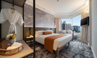 A room at a waterfront hotel in Kuala Lumpur with a bed or beds at Harbour Plaza Metropolis