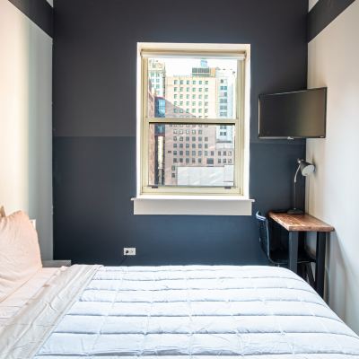 King-Size Bed Room With Shared Bathroom HI Chicago Hostel Promo Code