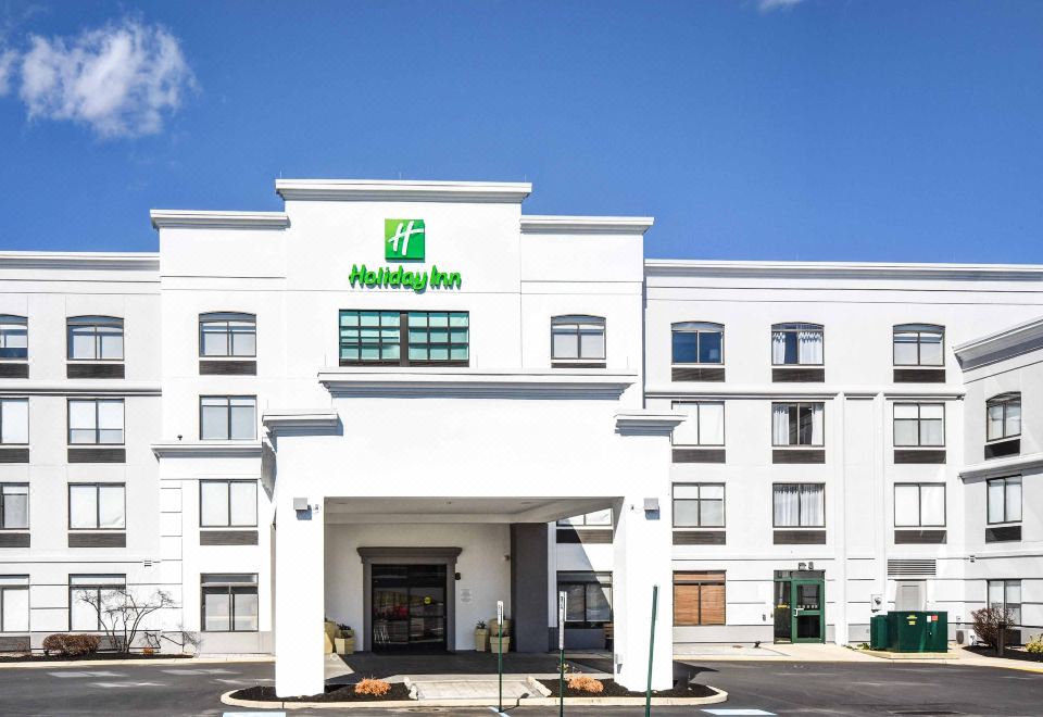 an exterior view of a holiday inn express hotel with a large sign above the entrance at Holiday Inn Allentown-Bethlehem
