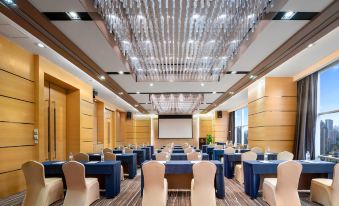A spacious room is arranged with tables and chairs for an event at a hotel or conference at Jianguo Hotel, Guangzhou
