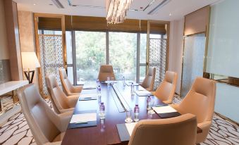 The hotel offers a spacious meeting room equipped with a long table and chairs, suitable for hosting meetings and corporate events at Dorsett Tsuen Wan