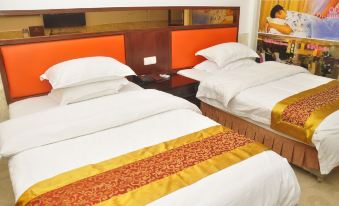 A couple is in a room with two double beds, each with a gold headboard on either side at Tongtong Hotel