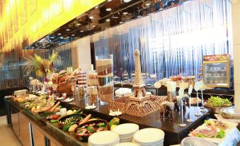 There is a table in the center with food and other items available for purchase at an oriental-themed location at Jinglun Hotel