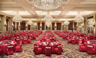 A ballroom has been arranged with tables and chairs for an event at the hotel or another location at Pudong Shangri-La, Shanghai