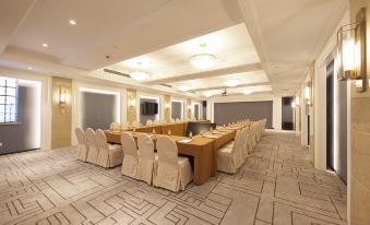 a venue prepared for an event or formal function, featuring spacious room with long tables and chairs at Metropolo Jinjiang Hotels Classiq (Shanghai Qingnianhui People's Square)