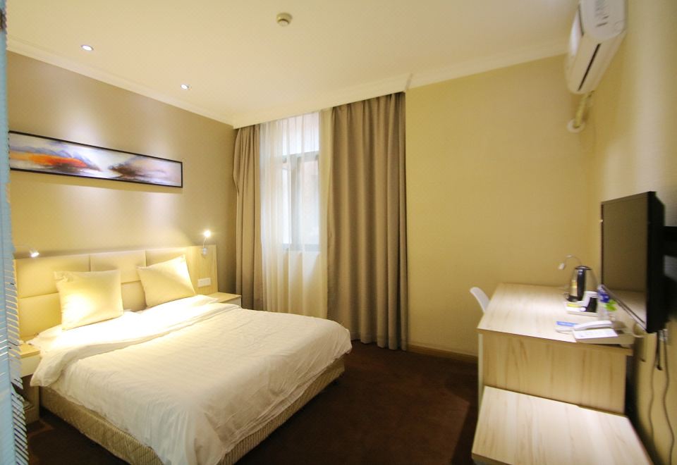 The bedroom features a double bed and a large window, with an adjacent bathroom that includes a bathtub and a separate shower at Fish Inn (Shanghai East Nanjing Road)