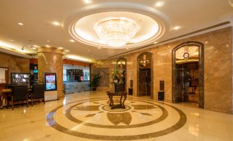 The lobby or reception area at Hotel Grand Kandyan Plaza Makati is being reviewed for grammatical accuracy, clarity, fluency, coherence, and the elimination of superfluous information, non-English expressions, and colloquial language at City Hotel