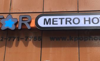The hotel's logo or sign is situated in front of Tokyo Shinagawa station at KSTAR METRO Hotel