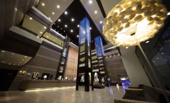 The lobby of this residential building is modern and spacious at Regal Riverside Hotel