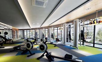 a large , well - equipped gym with various exercise equipment , such as treadmills , stationary bikes , and weight machines at KSL Hot Spring Resort