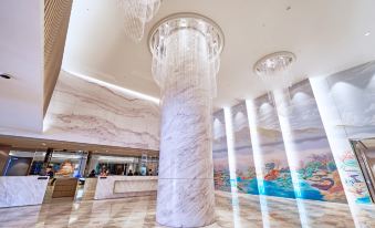 The lobby features a large mural on the ceiling and various hanging decorative items at Caesar Metro Taipei