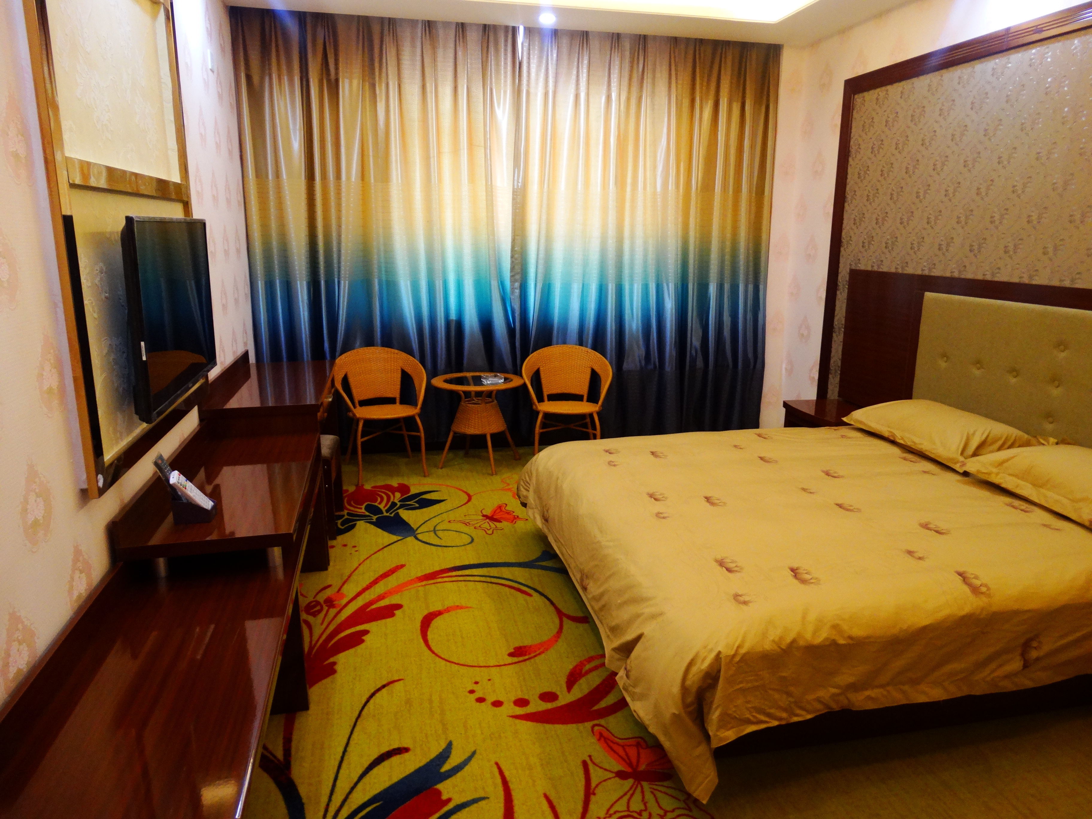 Mulei Sunshine Flower Garden HotelKing-size bed room