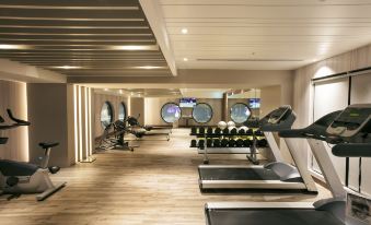 a well - equipped gym with various exercise equipment , including treadmills and weight machines , as well as a yoga studio at Hotel Valletta