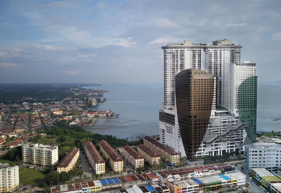 "a bird 's eye view of a city with buildings and water , including the "" surf avenue "" area" at DoubleTree by Hilton Melaka