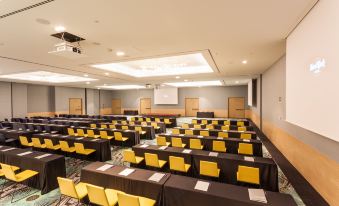 a large conference room filled with rows of chairs and tables , ready for a meeting or event at Hard Rock Hotel Ibiza
