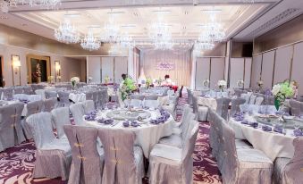 The ballroom is arranged for a wedding, with tables and chairs positioned to face each other at Dorsett Tsuen Wan