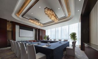 There is a spacious conference room equipped with long tables and chairs suitable for meetings and other business events at Shangri-La Hotel, Yiwu