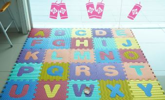 a colorful playmat with the letters a , b , c , d , e , f , g , h , i , j , k at Sun Inns Hotel Ayer Keroh