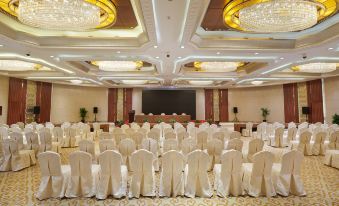 The hotel has a spacious ballroom equipped with rows of chairs, suitable for hosting events and functions at Bai Fu Yi Hotel