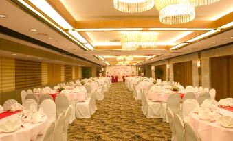 A ballroom is arranged for an event, with tables and chairs placed in the center at The Kimberley Hotel