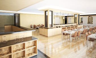 a modern restaurant with a wooden floor , an open kitchen , and multiple dining tables and chairs at Savero Hotel Depok