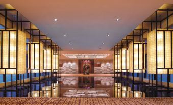 The lobby or reception features a spacious room with artistic flooring, wall-to-ceiling windows, and ample natural light at The Portman Ritz-Carlton, Shanghai