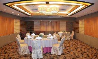 A ballroom is prepared with tables and chairs for an event at the hotel or conference at The Kimberley Hotel
