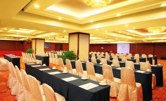 a ballroom with tables and chairs arranged for an event at Sunworld Hotel