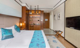 a modern bedroom with a large bed , wooden shelves , and a blue runner on the floor at Gengting Hotel