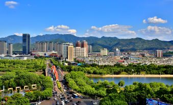 a city surrounded by mountains and water on both sides at YiWu Zhonglian Kaixin Hotel