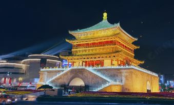 At night, the bell tower, a prominent illuminated structure in an Asian city at Desti Youth Park Hostel (Xi'an Bell Tower)