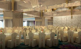 a large banquet hall with multiple round tables and chairs set up for a formal event at Okada Manila